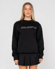 Person wearing a black sweatshirt with 'rusty' logo on a plain background