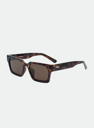 Sunglasses with tortoiseshell frame and dark lenses on a white background