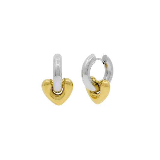 Heart-shaped hoop earrings in two-tone gold and silver on a white background