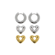 Set of heart-shaped earrings in silver and gold on a white background