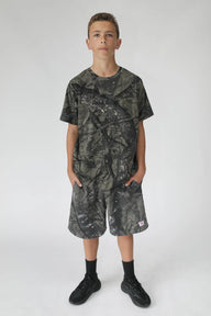 Person wearing a camouflage outfit on a white background