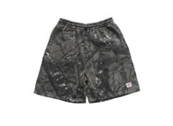 Black and gray camouflage shorts on a white background