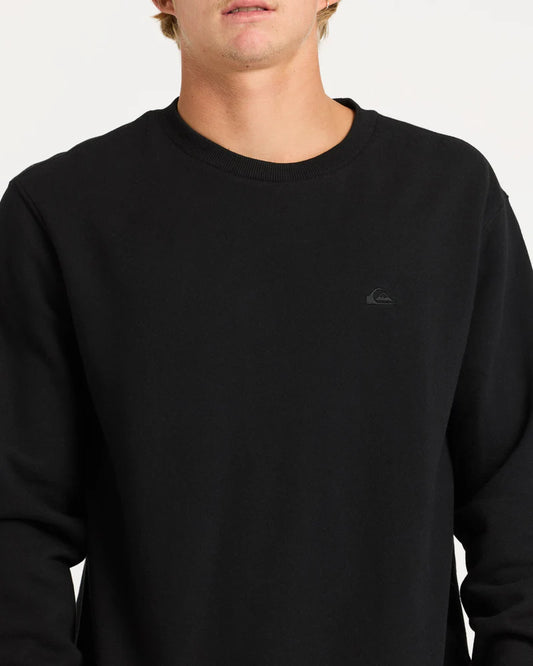 Black sweatshirt with a small logo on a plain background