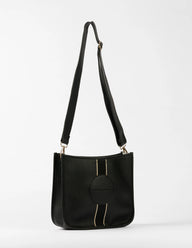 Black handbag with a strap on a white background