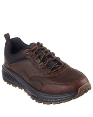 Brown leather shoe with black sole on a white background