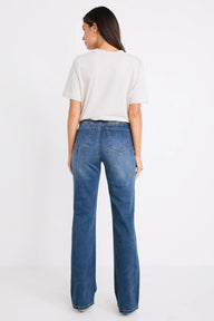 Person wearing blue jeans and a white t-shirt on a white background