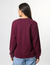 Person wearing a maroon sweatshirt on a white background