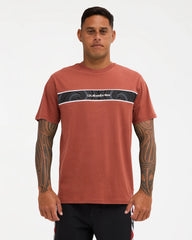 burnt orange tee with logo on chest with pattern 