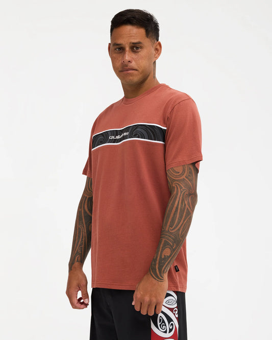 burnt orange tee with logo on chest with pattern 