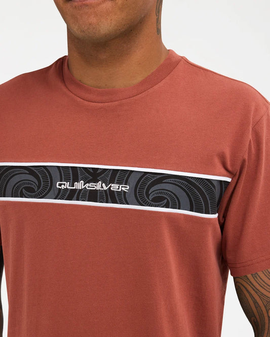 burnt orange tee with logo on chest with pattern 