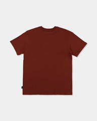 burnt orange tee with logo on chest with pattern 