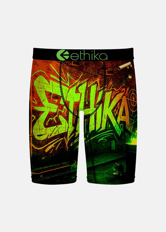 Graffiti-style shorts with 'ethika' branding on a white background