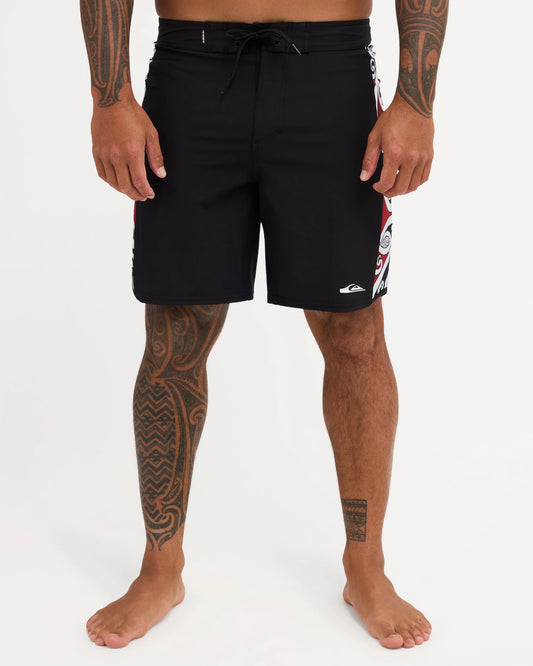 Black boardshort with Maori design along the side of short 