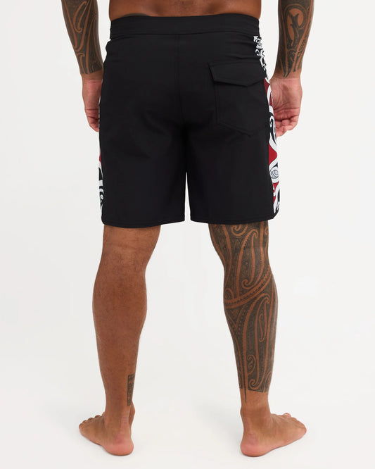 Black boardshort with Maori design along the side of short 
