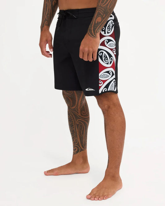 Black boardshort with Maori design along the side of short 