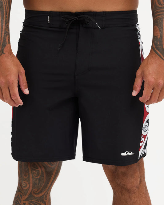 Black boardshort with Maori design along the side of short 