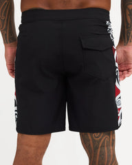 Black boardshort with Maori design along the side of short 