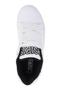 White sneaker with black sole and branding on a white background