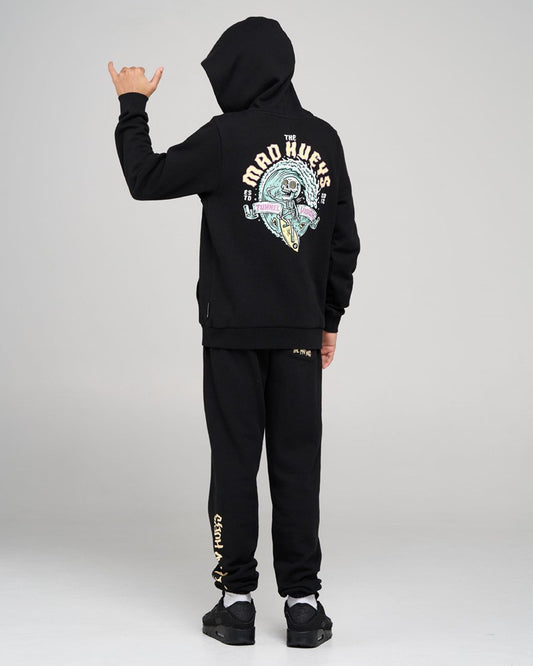 Person wearing a black hoodie and pants with a brand logo on the back, on a white background