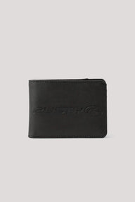 A black leather bifold wallet with an embossed 'RUSTY' logo and circular emblem on the front, displayed against a solid light gray background.