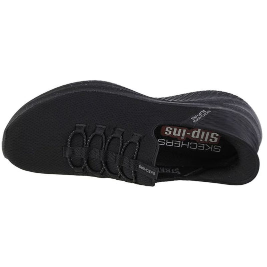 Black Skechers slip-in shoe on a white background