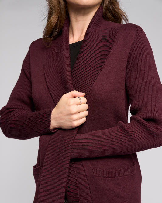 Maroon cardigan worn by a person on a light gray background