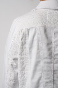 Close-up of Vassalli White denim jacket on a plain background