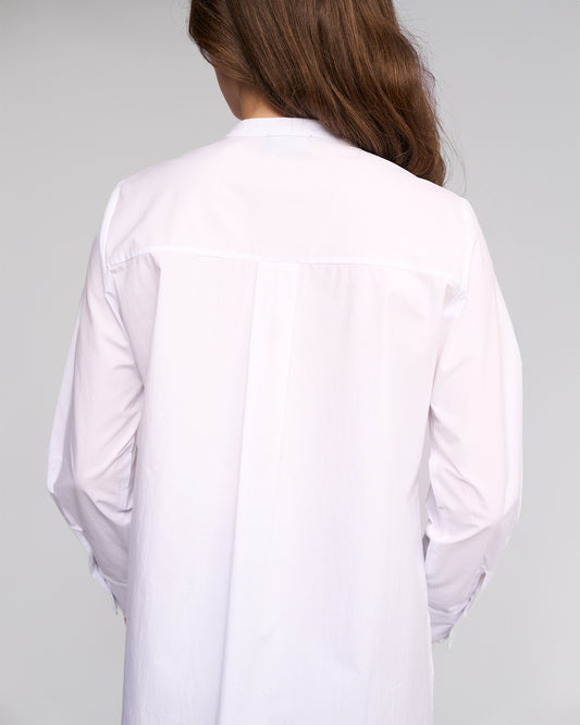 White shirt worn by a person on a gray background