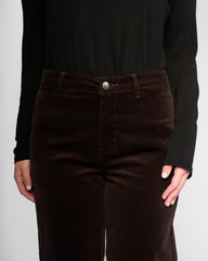 Brown pants worn by a person against a plain background