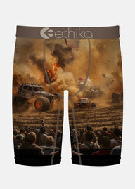 Boxer briefs with a graphic design of a monster truck event and 'ethika' branding.